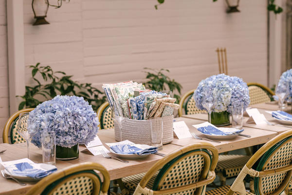 Tables with Acanthus napkins and baskets of samples