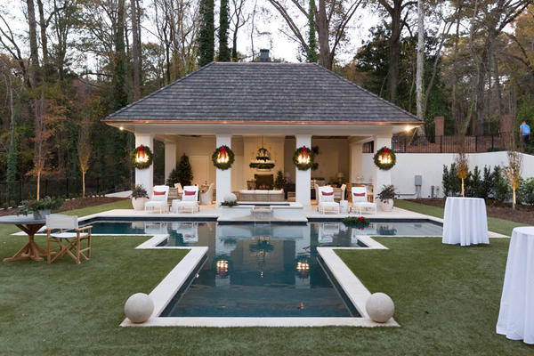 The showhouse’s outdoor spaces: architecture by Logan Design Group Architects; Cooking Pavilion design by Suzanne Kasler for Ballard Designs; turf by European Turf Company