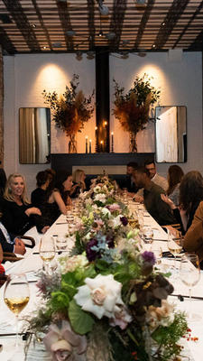 Guests gather at the dining table.