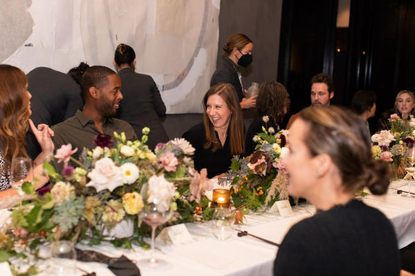Guests mingle during dinner.