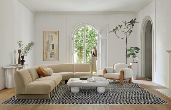 The Lena Sectional sofa, Clouded coffee table, James accent chair, Tatia console table, and Checkerboard rug.