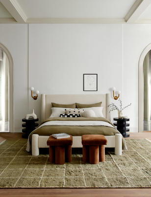 The Hyvva bed, Clover stool, Irregular Grid rug, and Pentwater round side table.