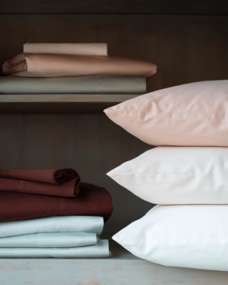 Bria pillowcases in Pearl, Rouge, Parchment, White and Mahogany. Bria sheets in Rouge, Eucalyptus, Mahogany, Cloud and Eucalyptus.