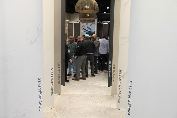 The booth’s entry featuring full slabs from the Outdoor collection (left) and the new Pebbles collection (right).