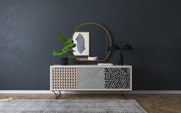 Characterized by a unique pattern on each of its three door fronts, the Jaiden credenza creates a modern tribal feel through a series of hand-placed, multi-tone bone inlays. Crafted of mango wood, it sits atop an iron base in a brass finish, an eye-catching statement piece for any living space.