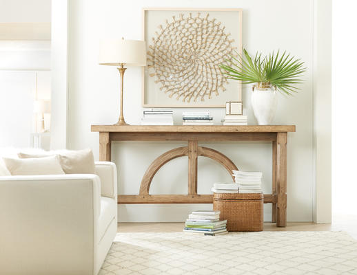 This streamlined yet elegant Commerce & Market console features a subtly beautiful natural wood finish with a half-circle motif at the base. Crafted from acacia and delicately distressed, its smooth surface invites touch.