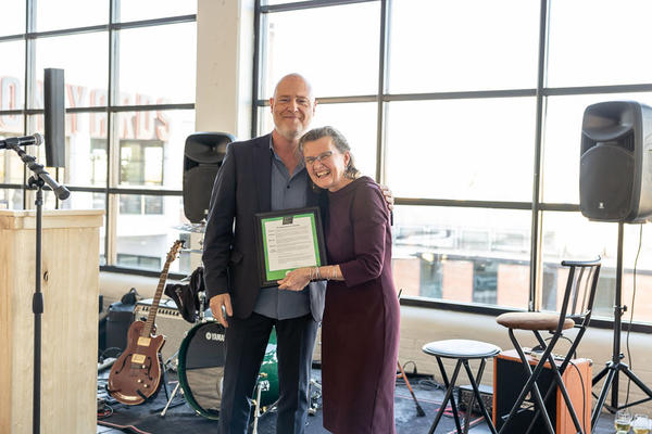Steven Salsberg of the American Sustainable Business Network and Susan Inglis, SFC outgoing executive director. Salsberg awarded the ASBN Presidential Proclamation to Inglis.