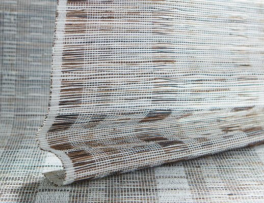 Stitch woven-to-size grassweave window covering

Stitch balances the linear architecture of the Bauhaus with the soft, natural appeal of Japanese designs. Multicolored abaca is freely hand-placed through an orderly framework of jacquard-handloomed ramie, creating a compelling play of tension and texture and a subtle sense of movement.