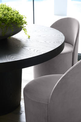 Detail of Margaux Side Chairs on casters and Tate Round Dining Table