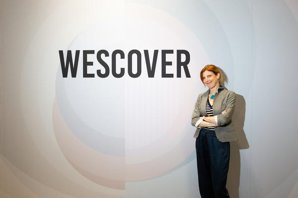 Jill Malek in front of one of her firm’s newly debuted wallcoverings