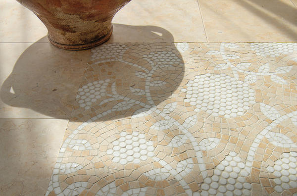 Amaranth, a hand-cut mosaic shown in tumbled Jerusalem Gold and Thassos, is part of the Biome collection by New Ravenna.