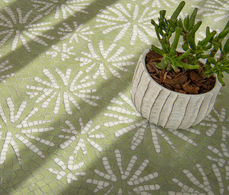 Fossil, a hand-chopped mosaic shown in tumbled Sweetgrass and Thassos, is part of the Biome collection by New Ravenna.