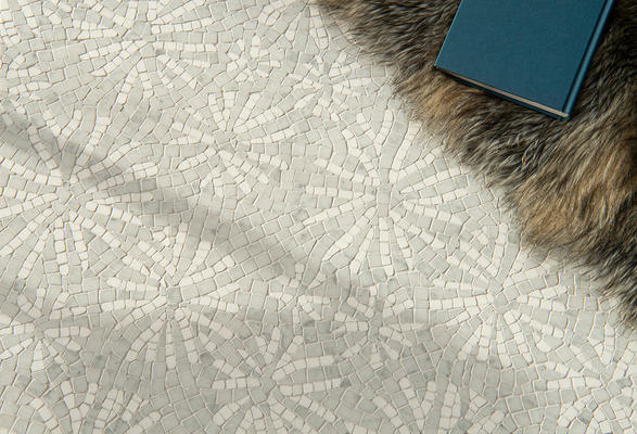 Fossil, a hand-chopped mosaic shown in tumbled Carrara and Thassos, is part of the Biome collection by New Ravenna.
