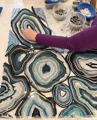 Geode, a hand-cut stone mosaic shown in honed Thassos, polished Indigo, Orchid, Cornflower, Hydrangea, Aloe, Lotus, Periwinkle, Celeste, Carrara, Blue Macauba and Aurum, is part of the Biome collection for New Ravenna.