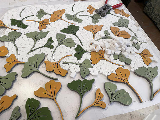 Ginkgo, a hand-cut and waterjet mosaic shown in honed Thassos, polished Sweetgrass, Fern and Goldenrod, is part of the Biome collection for New Ravenna.