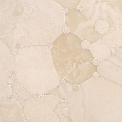 Seafoam, a waterjet mosaic shown in honed White Onyx, is part of the Biome collection for New Ravenna.