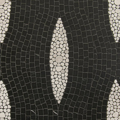 Stingray, a hand-chopped and waterjet mosaic shown in tumbled Nero Marquina and Thassos, is part of the Biome collection by New Ravenna.