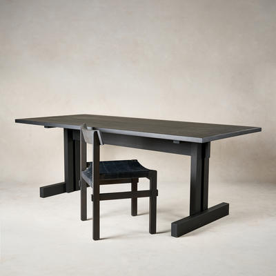 Shinto dining chair in black leather on a charcoal frame alongside Kyoto desk