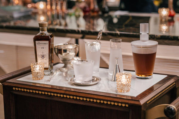 The bespoke bar cart experience serving the limited-time La Liqueur de René cocktail made with The Glenturret 15- year-old highland single malt scotch whiskey.