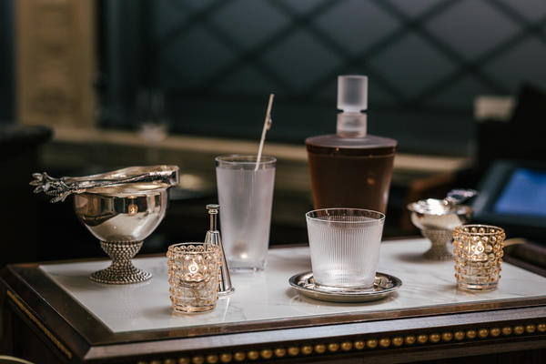The Lalique bar cart at Restaurant Daniel, featuring Mossi votives and the Wingen barware collection.