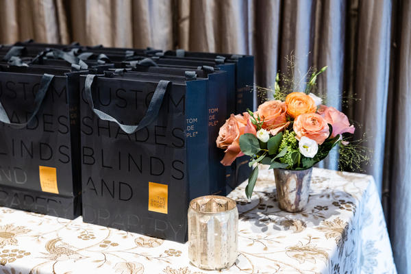 Gift bag table dressed in a custom linen from the Martyn Lawrence Bullard collection