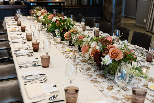 Sepia-toned florals and a custom runner in Martyn Lawrence Bullard for The Shade Store fabric adorned the table.
