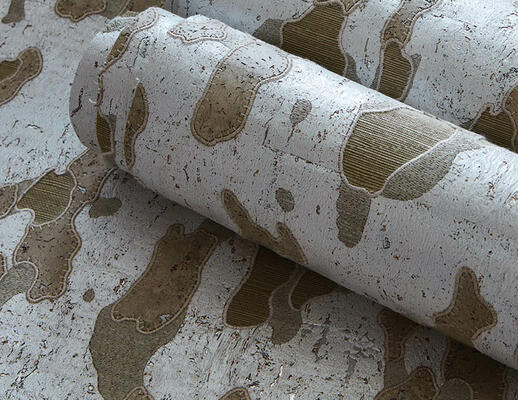 Reminiscent of tree bark, the Sycamore natural wallcovering series features a captivating camouflage pattern. Rendered in a complex layering of sisal, silver-painted paper, laser-cut cork and metallic embroidery, the mottled motif presents an interplay of materials that brings rich depth and organic beauty to any room.