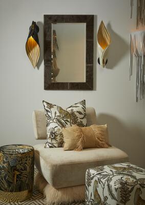Blade wall sconces made of vegetable-tanned leather can be installed in either the upright or down-facing direction. Shown paired with the Wildebeest rectangle mirror.