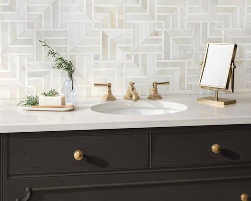 Delaunay, in polished Cloud Nine and Dolomite, is a hand-cut mosaic from the Studio Line by New Ravenna.