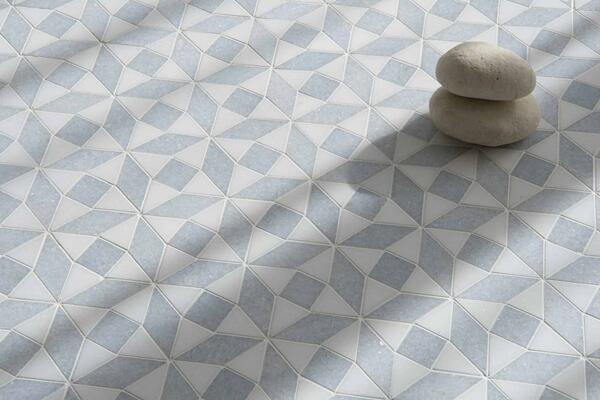 Esmeralda, a hand-cut mosaic shown in polished Thassos and Celeste, is part of the Studio Line collection by New Ravenna.