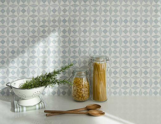 Esmeralda, a hand-cut mosaic shown in polished Thassos and Celeste, is part of the Studio Line collection by New Ravenna.