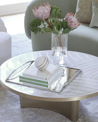 Georgia coffee table, an eye-catching design featuring an Italian Carrara marble top with a curved brass inlay motif that complements the style of the sculptural pedestal base. Also available as an entry table.