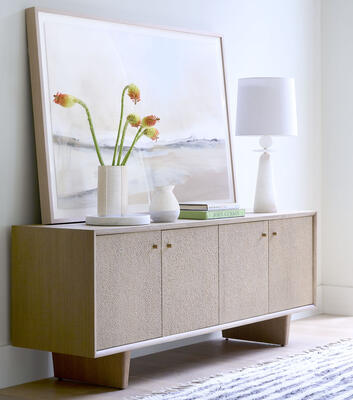 Reyes media console, a Scandinavian-inspired design crafted from white oak that contrasts clean lines with textural carved doors.