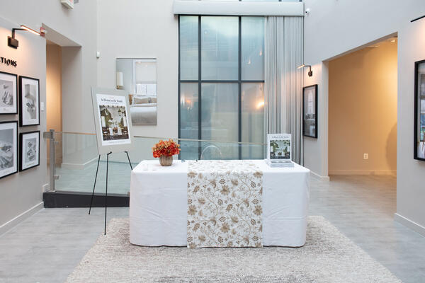 The book signing area was set up with a custom table runner in Martyn Lawrence Bullard for The Shade Store Boho Vine textile in Nature.