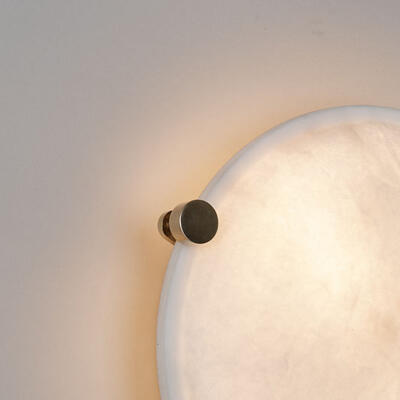 Through natural Italian alabaster, the Buriton flush wall and ceiling light emits a warm, diffuse glow.