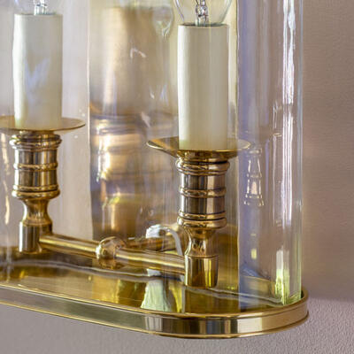 A cast-brass top and base frame the Sandford wall lantern.