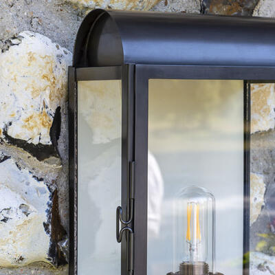 The Tichfield wall lantern is hand-fabricated from solid brass sheeting with a sturdy frame for outdoor use.