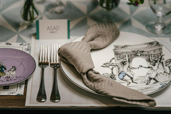 Table setting with a custom runner and napkins from the Sheila Bridges for The Shade Store collection and plates by Sheila Bridges for Wedgwood
