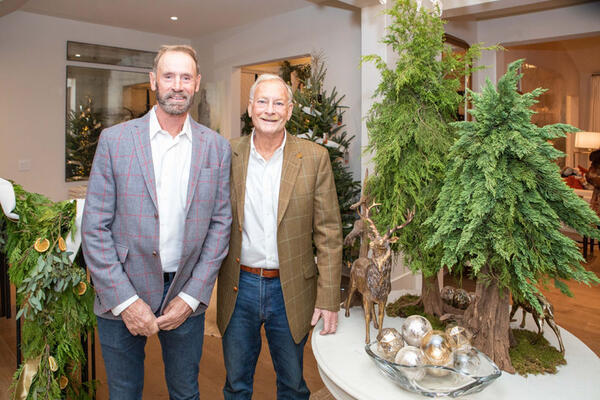 Honorary chairs Randy Korando and Dan Belman of Boxwoods Gardens & Gifts designed the foyer and hallway, the exterior holiday greenery and decor.