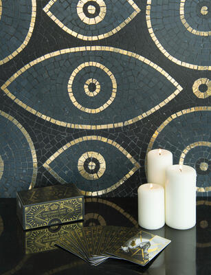 Amulet, a hand-cut stone mosaic shown in tumbled Nero Marquina, Orchid and polished Aurum, is part of the Heritage collection by New Ravenna.