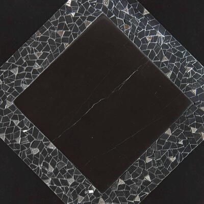 Avenue, a hand-cut stone mosaic shown in venetian honed Nero Marquina and tumbled Nero Marquina with polished Mercury, is part of the Heritage collection by New Ravenna.