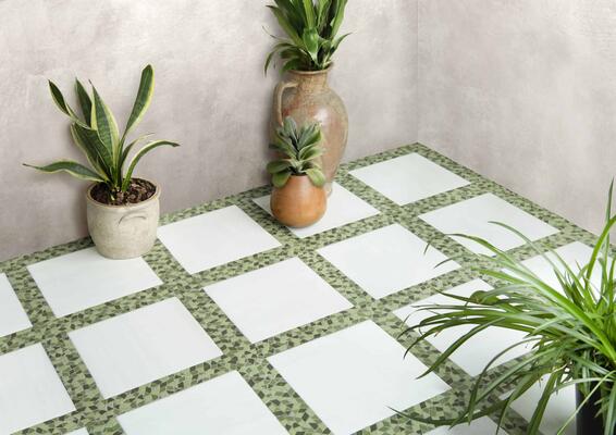 Avenue, a hand-cut stone mosaic shown in venetian honed Dolomite, tumbled Sweetgrass, Fern and Olive, is part of the Heritage collection by New Ravenna.