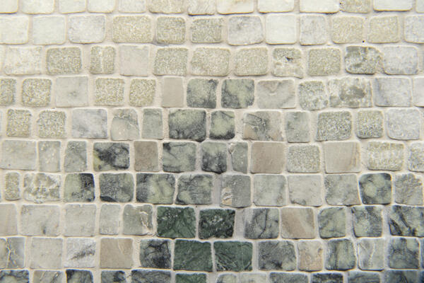 Canopy Mist, a hand-chopped stone mosaic shown in tumbled Ming Green, Lichen, Verde Luna, Oyster and Spring Green, is part of the Heritage collection by New Ravenna.