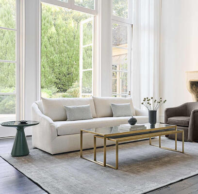 The Laurel collection combines a refined look with luxe comfort. Sophisticated yet casual, the low-slung sofa is cozy for conversing or reclining. Create a more relaxed or elegant look, depending on your fabric or leather choice. Shown with the Addie side table in new Spruce finish.