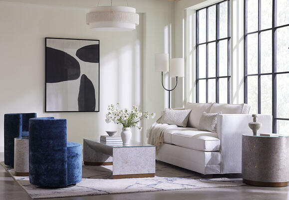 Perfect additions: the Ambrose collection of modern accent tables in cork. With inviting curves, clean lines and rich materiality, they add subtle pattern and color to a room. Seen here with the Keaton sleeper sofa and Poppy swivel chair.