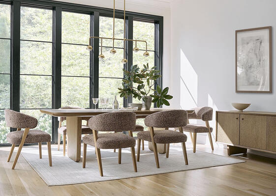 Scandi-inspired, the Reyes dining table is exquisitely crafted in white oak. Rounded edges and a tapered base give it a relaxed feel that’s reiterated by the textural Reyes console. Shown here with Keane chairs in a Kravet fabric, one of many styles that complement it