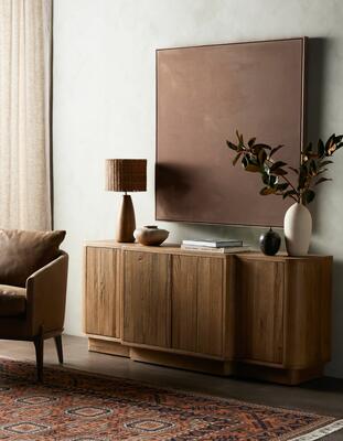 “In the Quiet Earth” by Melody Joy McMunn overlooks the Allandale sideboard and Hingol rug, all from Four Hands.