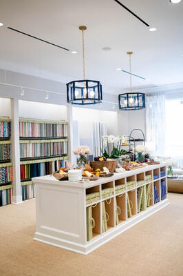 A full library of Thibaut and Anna French collection books and hanging fabric sample display