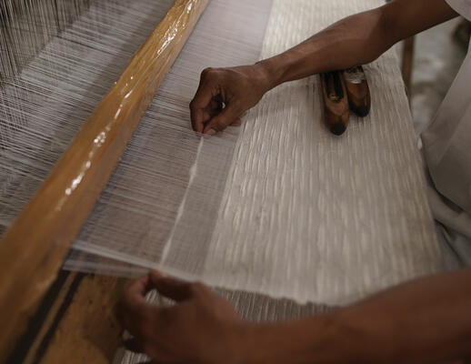 Whitecaps on the loom: Shades are hand-woven to size, up to 180" wide.