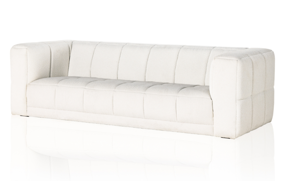 The Tavi sofa in easy-to-clean Fiqa Boucle Natural is grand in both scale and comfort.